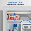 Interior view of a refrigerator showing a drawer with ice cream and ice cubes, and a carton of milk below. Produktbild-Vorschau