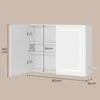 A white illuminated medicine cabinet with its doors open, showing dimensions and internal shelves. Produktbild-Vorschau
