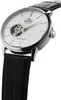 A close-up, angled shot of a men's wristwatch with a white face and a black leather strap. Podgląd zdjęcia produktu