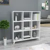 A white bookshelf with various decorative items and books on display, set against a gray wall. Produktbild-Vorschau