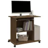 A computer desk with a monitor, keyboard, books, and a computer tower. Podgląd zdjęcia produktu