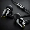 A close-up shot of two in-ear headphones with a black cable and a silver inline control module. Produktbild-Vorschau
