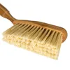 A close-up shot of a brush with a bamboo handle and beige bristles, isolated on a white background. Produktbild-Vorschau
