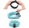 A three-panel image showing how to use a Velcro strap to secure a coiled hose. Produktbild-Vorschau