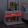 A white nightstand with red LED lighting in an open compartment. Náhľad obrázku produktu