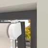Close-up of a white roller blind mechanism attached to a window frame. Produktbild-Vorschau