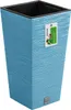 A blue planter with a textured surface, shown against a white background. A product tag is attached to the planter. Voir les images du produit