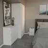 A bedroom scene with a dresser, wardrobe, and bed. Anteprima dell’immagine prodotto