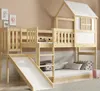 A wooden bunk bed with a slide and a house-like structure on top, set in a child's bedroom. Produktbild-Vorschau