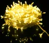 A tangled ball of yellow LED string lights on a reflective black surface. Náhled obrázku produktu