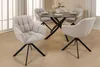A dining set with a round table and four chairs in a room. Produktbild-Vorschau