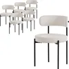 A set of six white upholstered chairs with black metal legs are shown, with one chair prominently displayed in the foreground. Produktbild-Vorschau