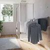 A modern bathroom or laundry room with a window, a shower enclosure, and a wall-mounted drying rack with clothes. Produktbild-Vorschau