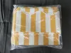 A striped awning fabric is packaged in clear plastic. Produktbild-Vorschau