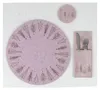 A set of festive placemats and a coaster with a tree design. Produktbild-Vorschau