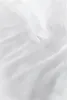 A close-up, top-down view of white bedding, showing the texture and folds of the fabric. Produktbild-Vorschau