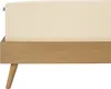 A close-up view of a bed frame with a cream-colored sheet. Produktbild-Vorschau
