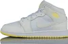 A side view of a white and pale yellow Nike Air Jordan 1 Mid sneaker against a white background. Podgląd zdjęcia produktu