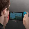 A person is playing a video game on a Nintendo Switch while wearing wireless earbuds. Podgląd zdjęcia produktu