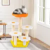 A cat is resting on a multi-tiered cat tree with flower-shaped platforms, placed indoors near a window. Podgląd zdjęcia produktu