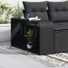 A close-up shot of a black rattan storage shelf unit next to a sofa on a patio. Náhled obrázku produktu