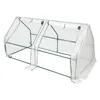 A white and green mini greenhouse. Produktbild-Vorschau