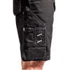 A close-up view of the side of black work shorts, showing a cargo pocket with straps and stitching. Produktbild-Vorschau