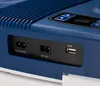 A close-up view of the ports and control panel of a blue mini refrigerator. Náhled obrázku produktu