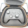 A close-up view of a gray Xbox controller inside its black and orange carrying case. Podgląd zdjęcia produktu