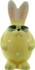 A yellow ceramic Easter bunny figurine wearing sunglasses. Produktbild-Vorschau