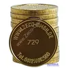 A stack of gold-colored tokens with text and numbers imprinted on them, presented against a white background. Produktbild-Vorschau