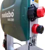 Close-up of a green and gray Metabo BAS 261 precision electric bandsaw, showing red adjustment knobs. Anteprima dell’immagine prodotto