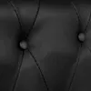 A close-up view of black faux leather upholstery with tufted buttons. Produktbild-Vorschau
