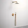 A modern rose gold shower set mounted on a white wall. Náhled obrázku produktu