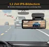 A dashcam mounted on a car's rearview mirror, showing a view of the road ahead and a blue car. Produktbild-Vorschau
