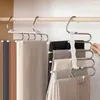 Two multi-tiered hangers are displayed in a closet, each holding several pairs of pants. A hand is shown adjusting one of the hangers. Anteprima dell’immagine prodotto