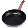 A black frying pan with a wooden handle, shown against a white background. Produktbild-Vorschau