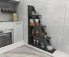 A modern kitchen corner with a grey tiled wall, white cabinets, and a grey ladder shelf filled with decorative items and jars. Náhled obrázku produktu