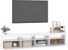 A white TV stand with a large flat-screen TV mounted above it. Produktbild-Vorschau