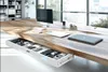 A modern office desk with an open drawer showing various office supplies. Náhľad obrázku produktu