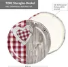 A close-up view of a jar lid with a red and white checkered heart design and a wood-grain pattern. Podgląd zdjęcia produktu