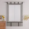 A sheer gray curtain hangs on a window, with a wooden dresser and a vase of flowers to the left, and a decorative branch to the right. Produktbild-Vorschau