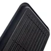 Close-up view of a black plastic dish rack with a ribbed surface and a raised rim. Podgląd zdjęcia produktu
