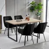 A dining set with four black chairs around a wooden table. Voir les images du produit