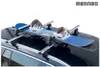 A snowboard and bindings are mounted on a roof rack on top of a car. Podgląd zdjęcia produktu
