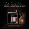 A 3D printer is shown in a dark studio setting with spotlights highlighting the machine and its features. Produktbild-Vorschau