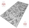 A rectangular panel with a marble-like pattern, presented at an angle on a white background. Náhled obrázku produktu