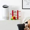 A white air purifier is shown next to a wooden toy on a white dresser. Anteprima dell’immagine prodotto