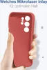 A hand holding a red phone case with cutouts for a camera module. Produktbild-Vorschau