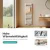 A bathroom scene featuring a white towel warmer, with a window showing greenery and a vanity with sink and toiletries. Produktbild-Vorschau